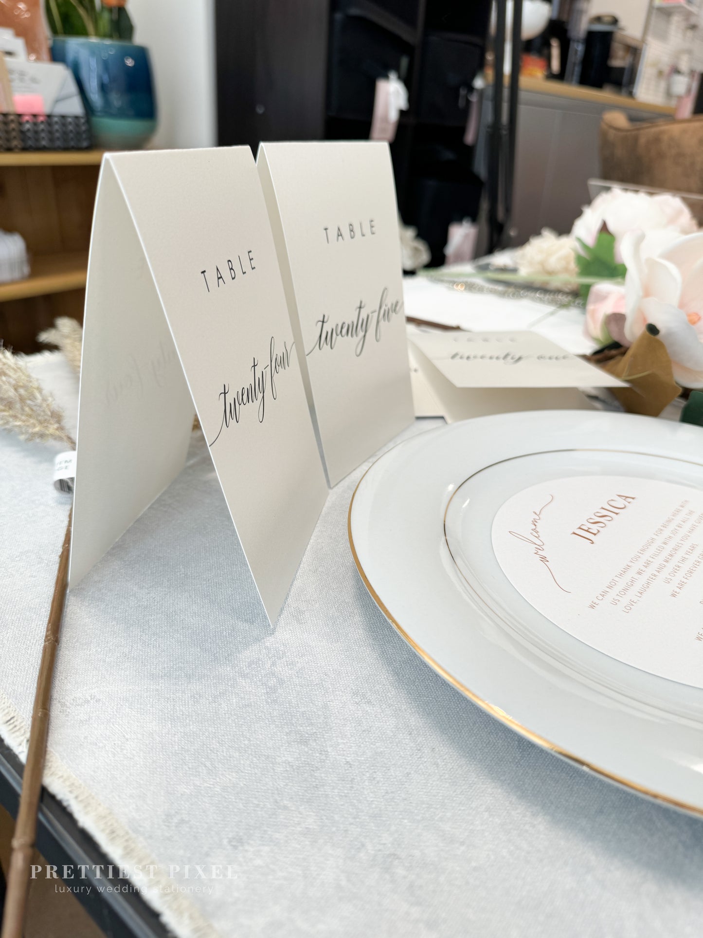 a table setting with place cards and place settings