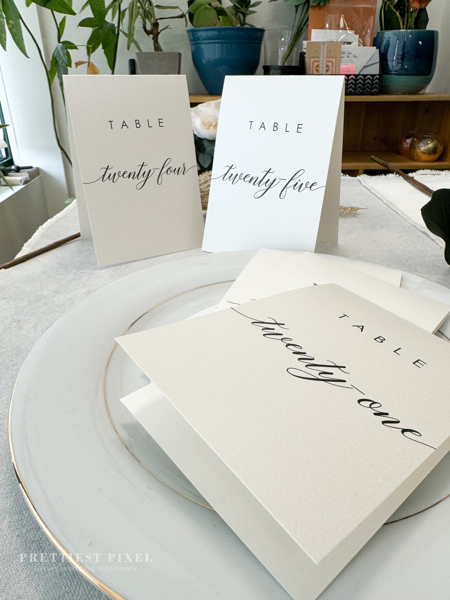 a table setting with place cards and place cards