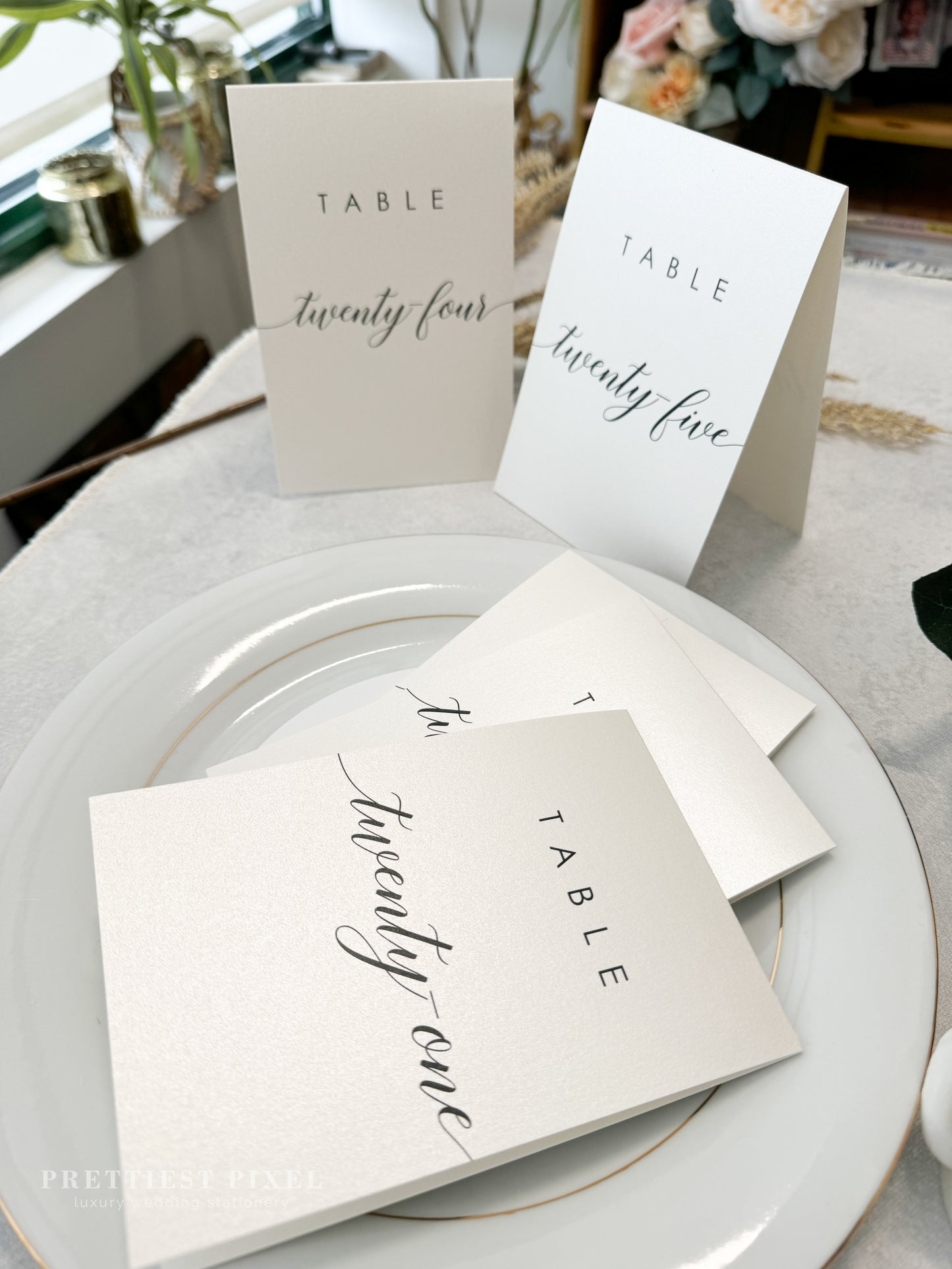 a table setting with place cards and place cards