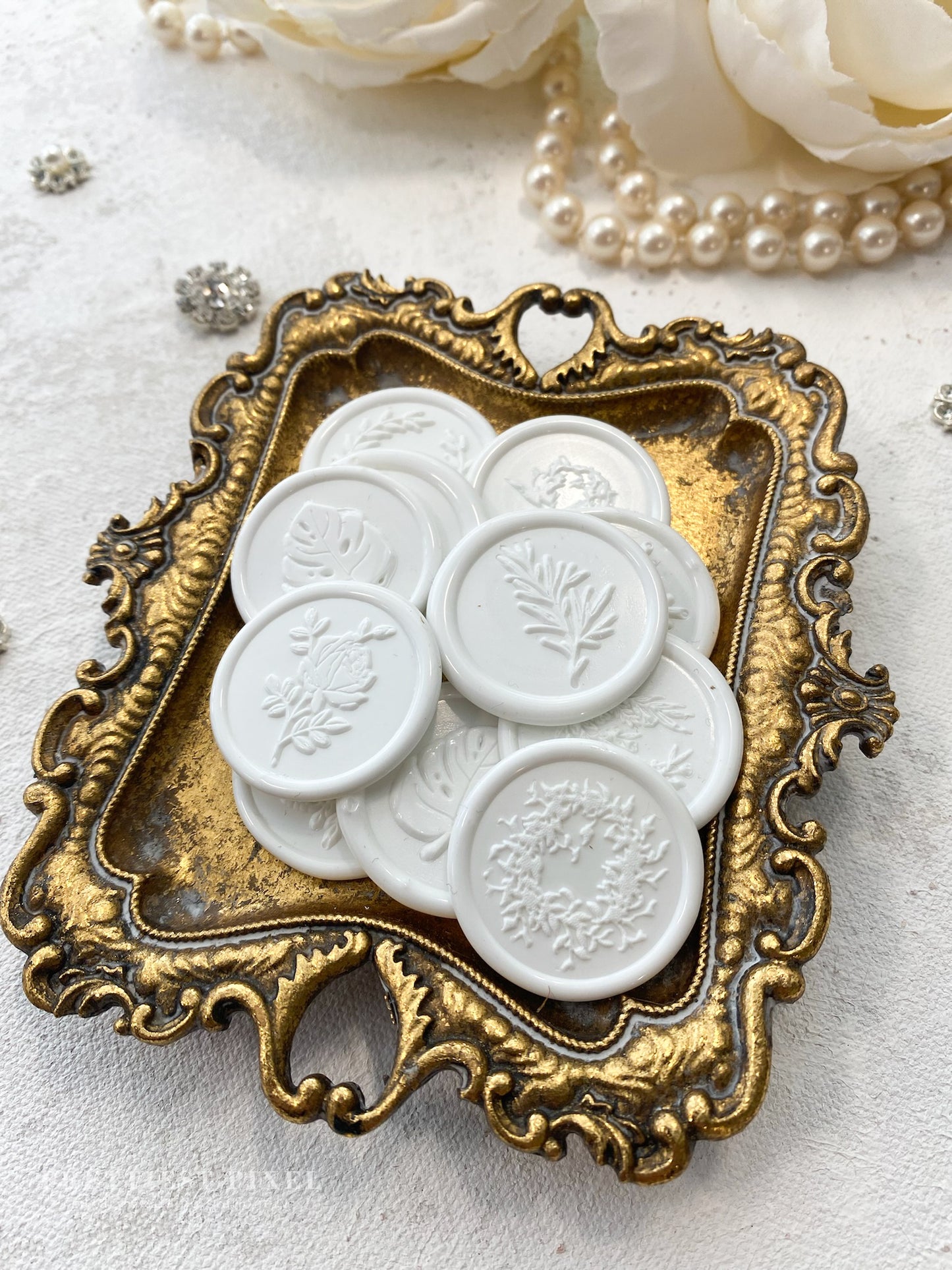 a close up of a tray of buttons on a table