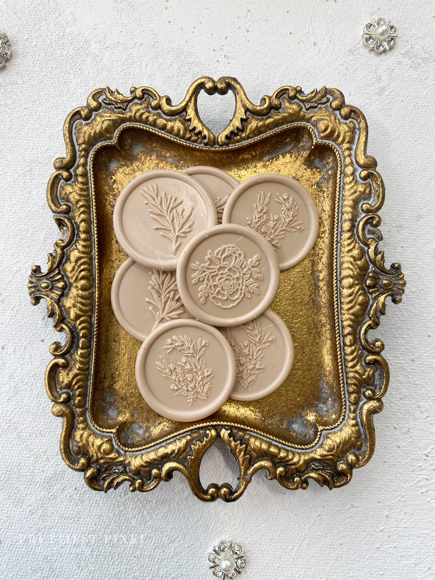 a decorative tray with four plates in it