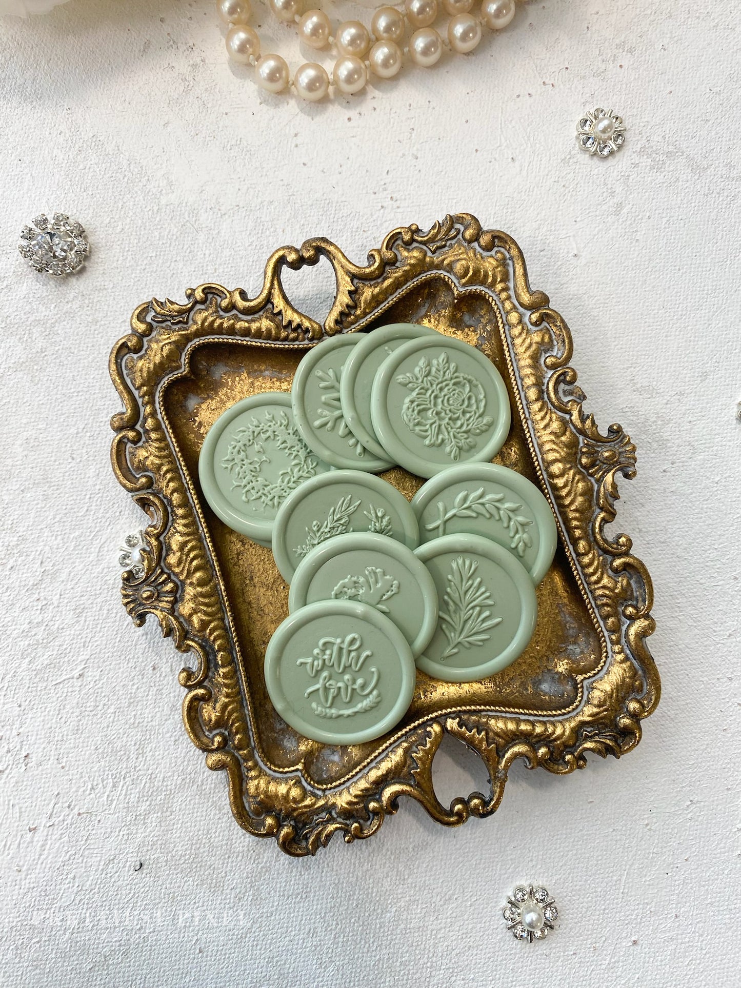a close up of buttons in a frame on a table