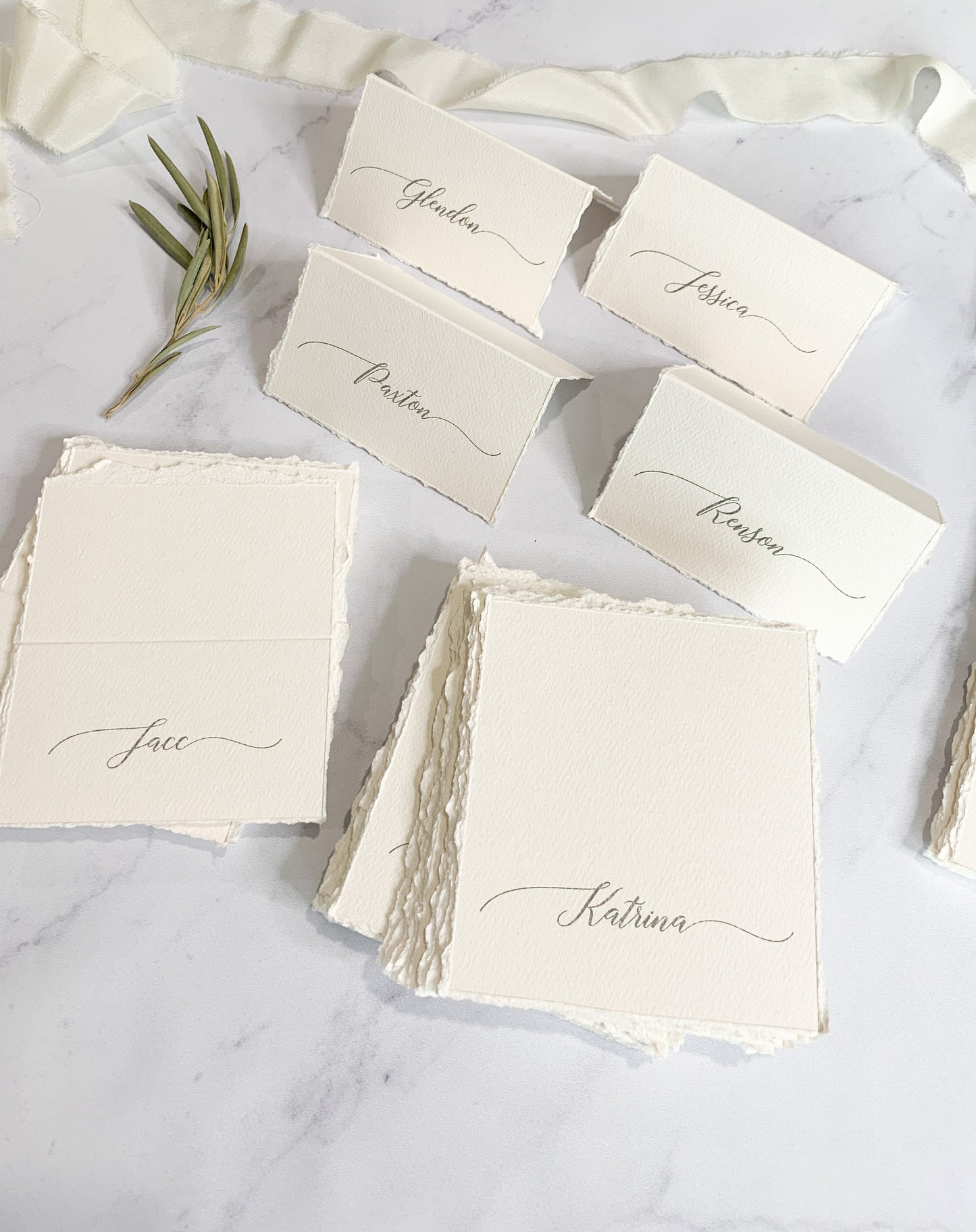 a table topped with cards and place cards