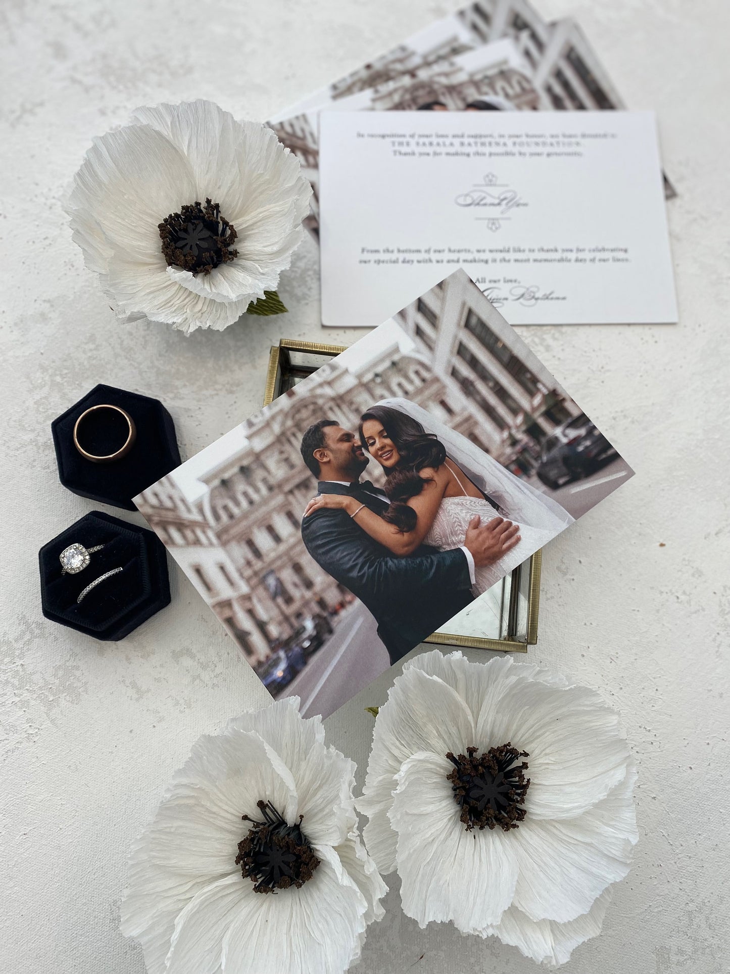 a picture of a couple on a table with flowers
