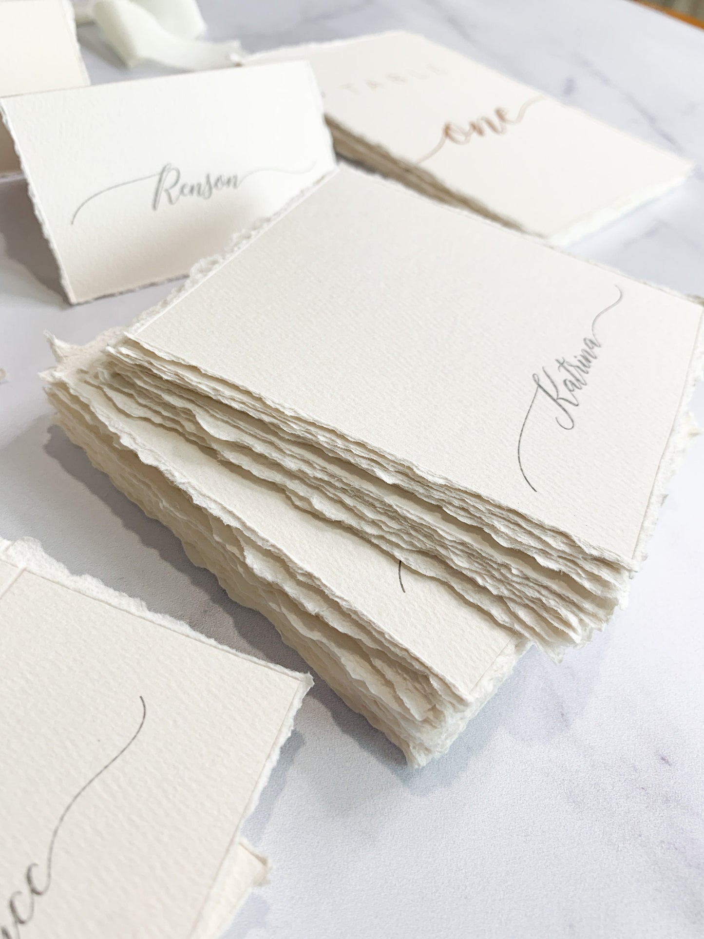 a table topped with lots of white cards