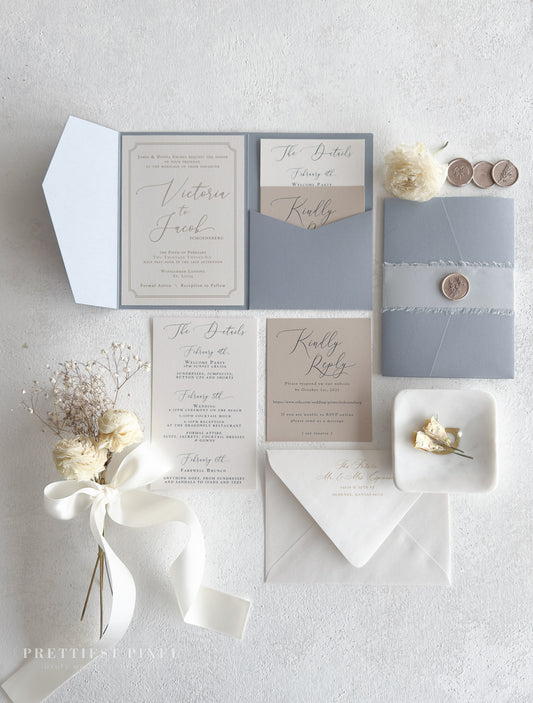 a collection of wedding-related items, including a wedding invitation, stationery, and decorative elements such as flowers and a ribbon.