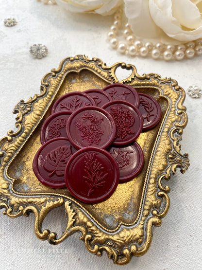 a bunch of wax seals sitting on top of a tray