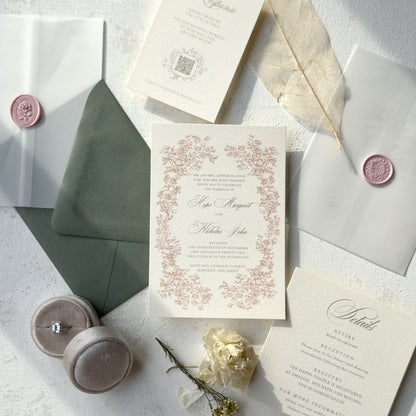 Wedding invitation set with envelopes and decorative elements on a light surface