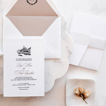 Wedding invitation card with envelope on a light surface