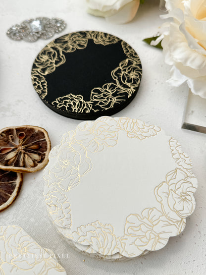 a table topped with plates and flowers on top of a table