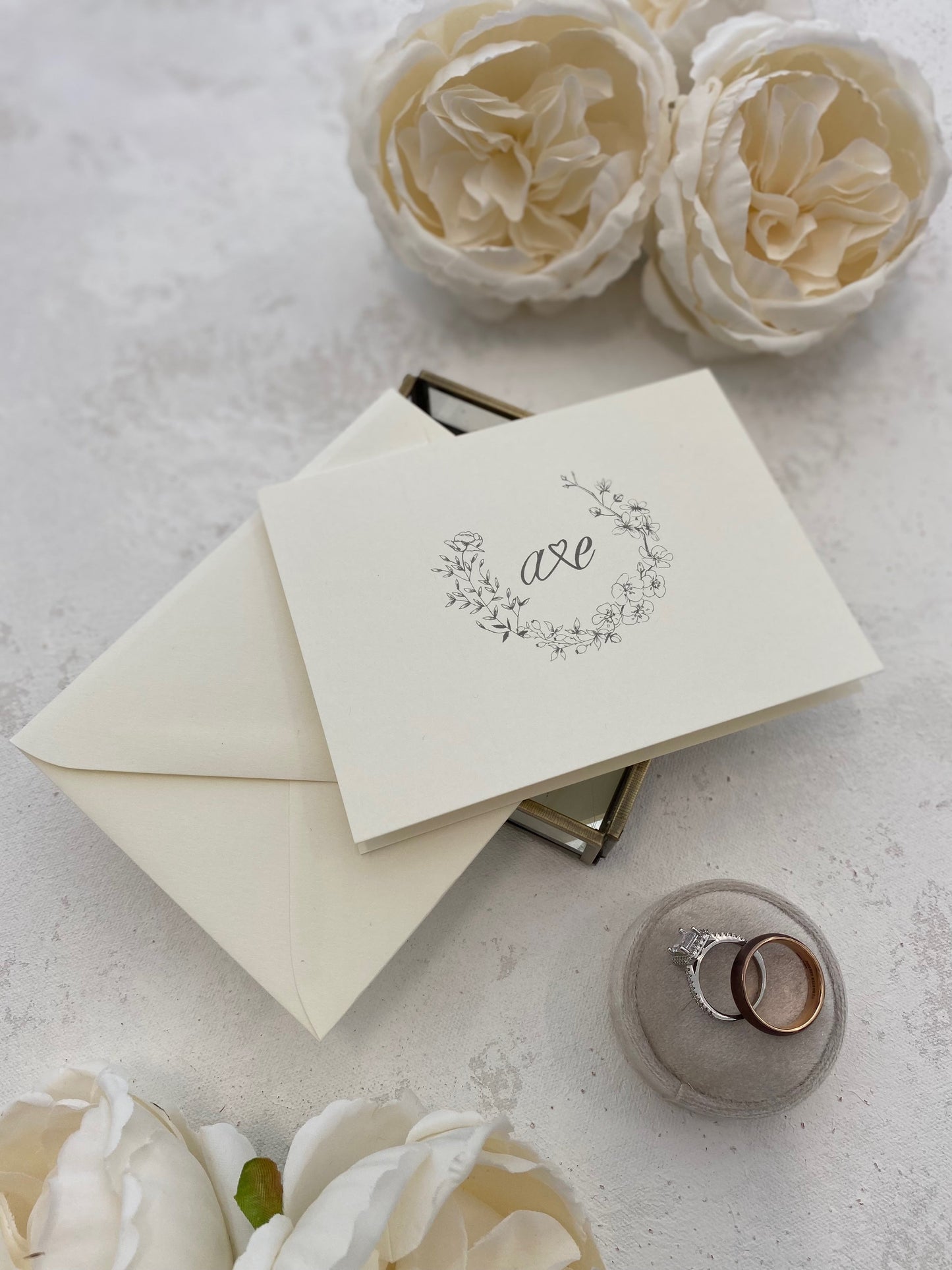 a couple of white flowers sitting on top of a table