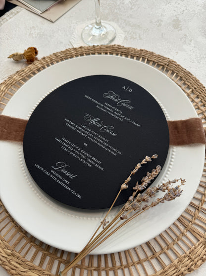 a black and white menu on a white plate