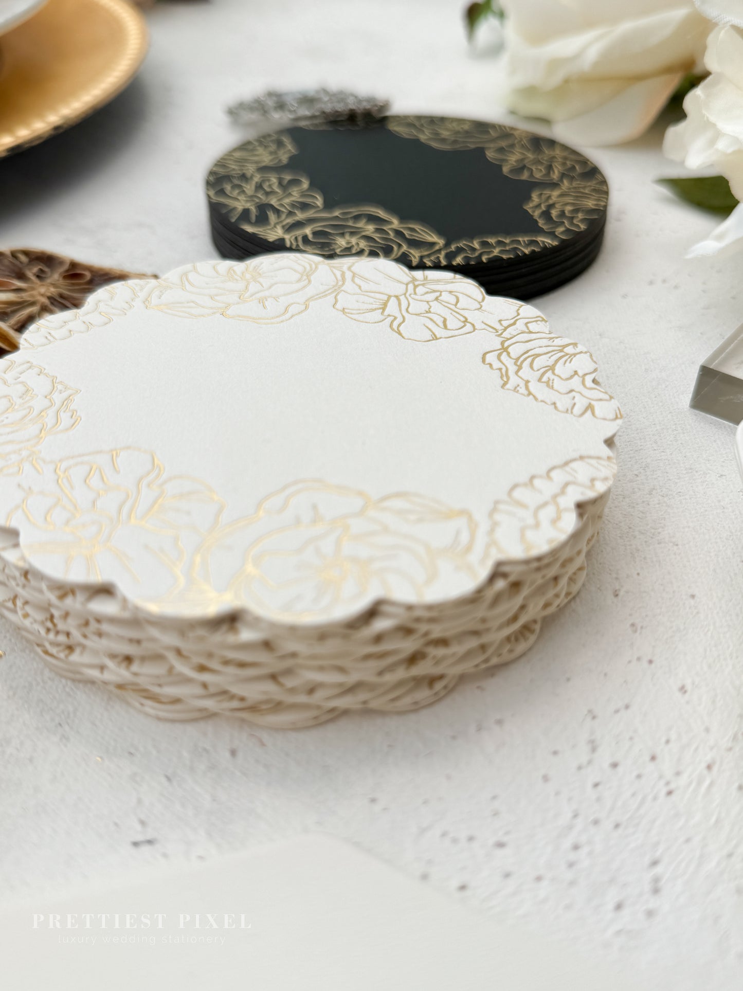 a table topped with plates and flowers on top of a table