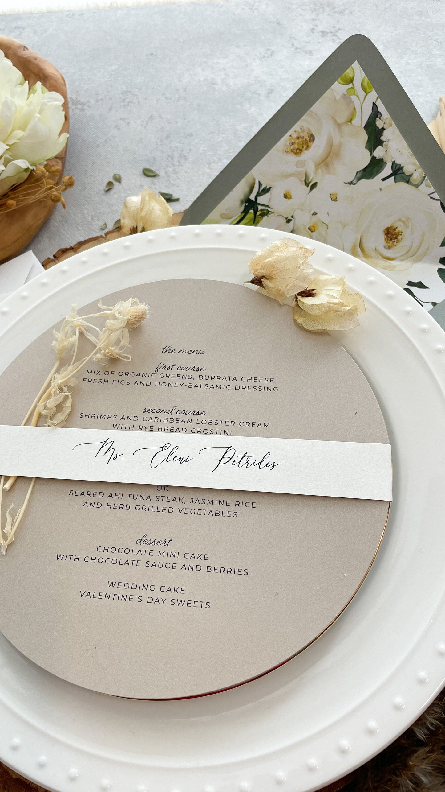 a white plate with a wedding program on it