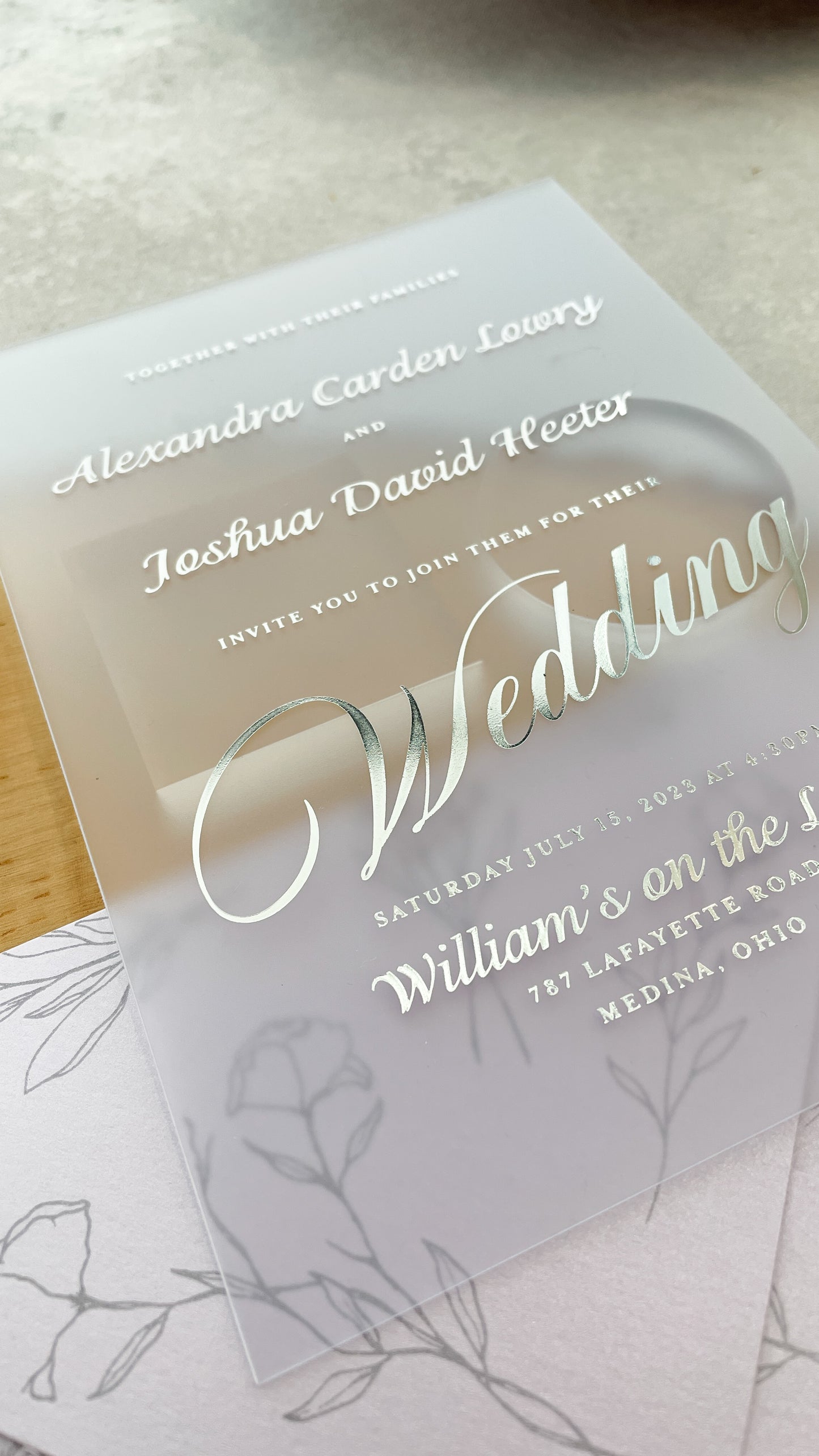 a close up of a wedding card on a table