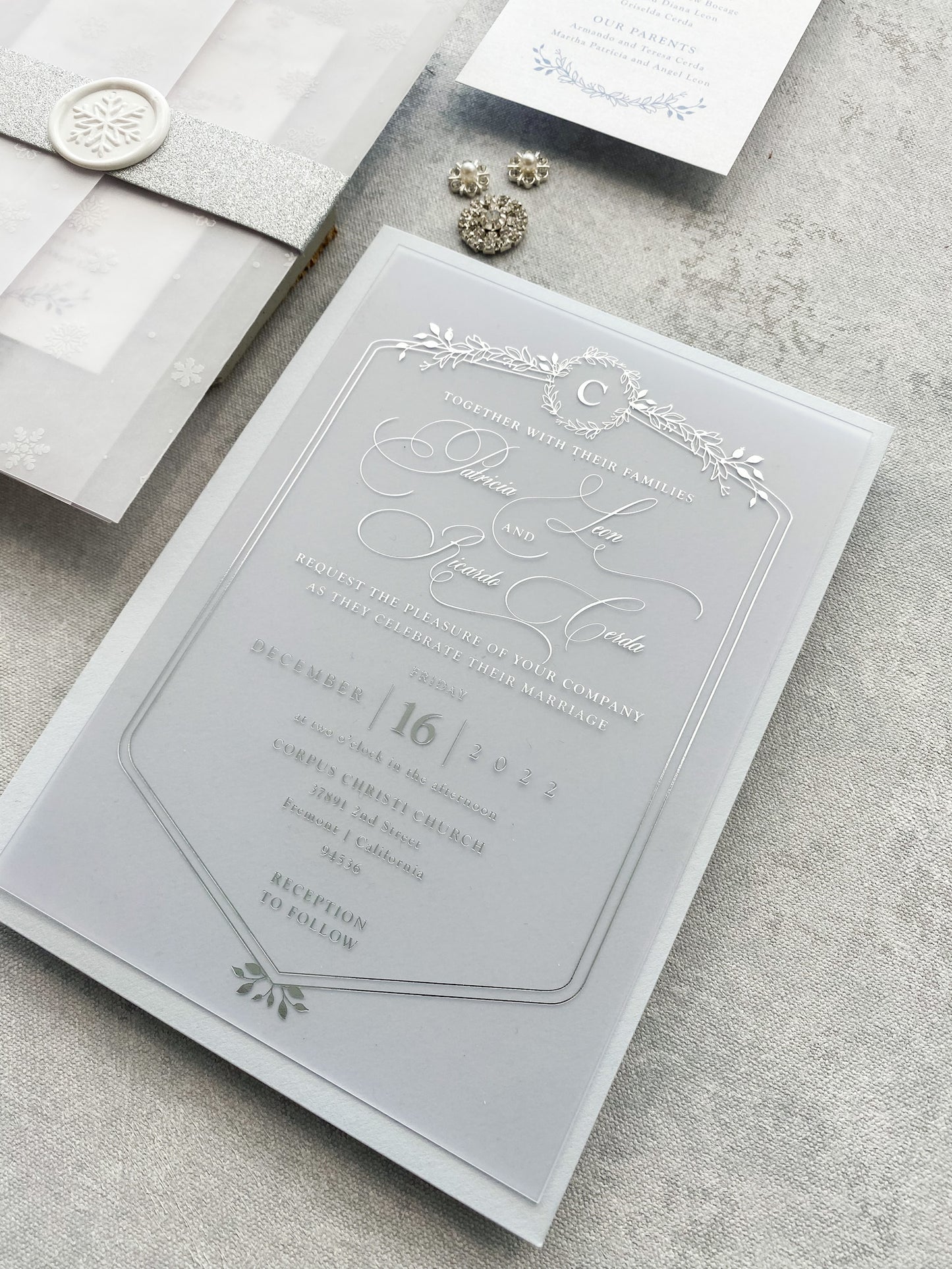a wedding suite with a silver and white wedding card